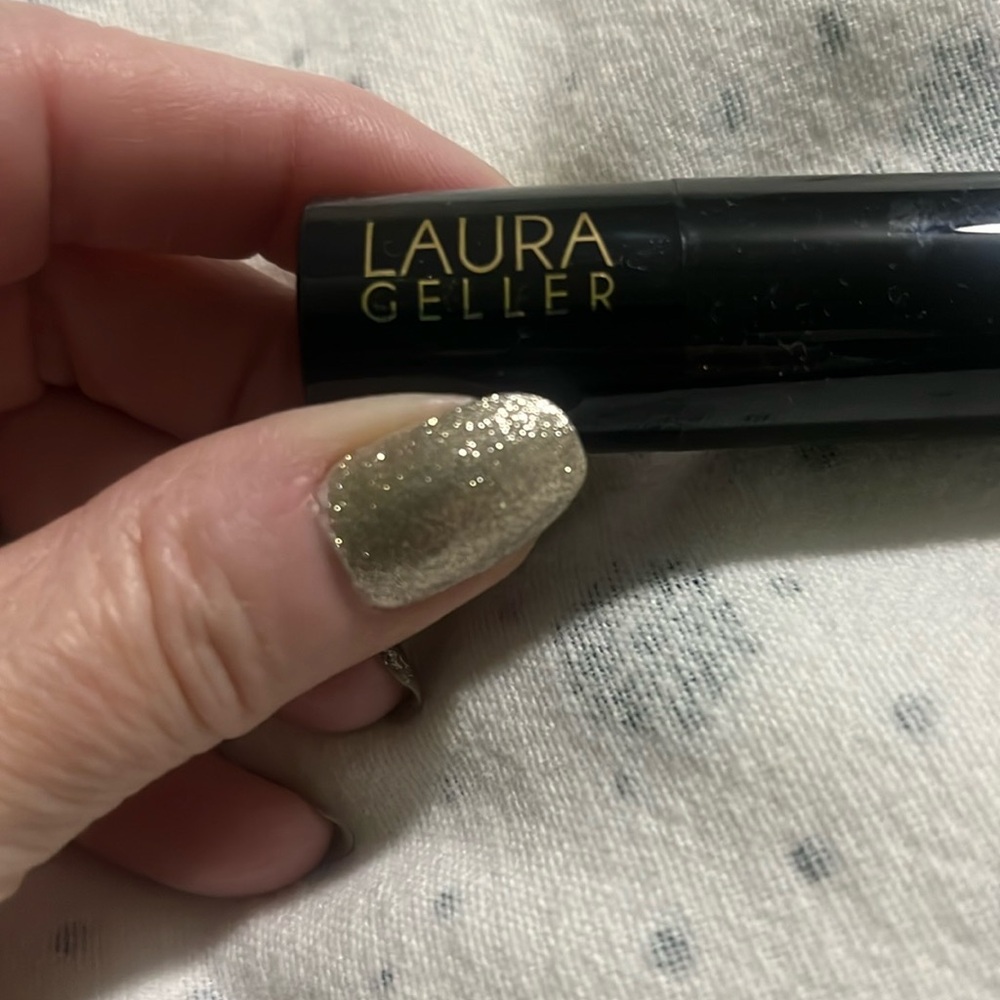 NWT- in box-Laura Geller lipstick : Magnificent in Mauve. outer layer of gold.
